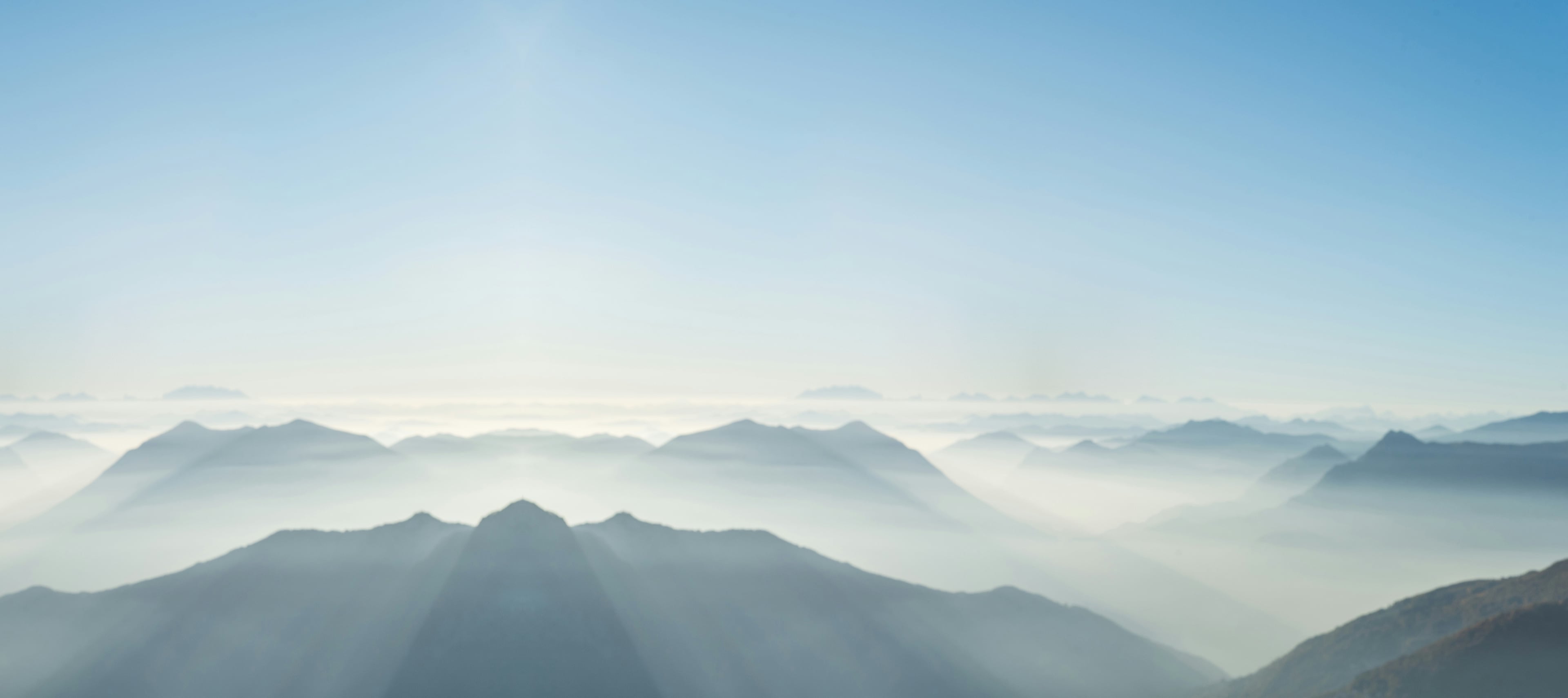 A small quadcopter hovering above misty mountain ridges, marked up with the task it has been given